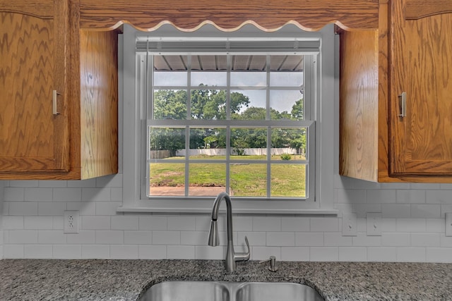 520 Almaville Rd, Smyrna, TN 37167 - kitchen featuring a sink, backsplash, and brown cabinets