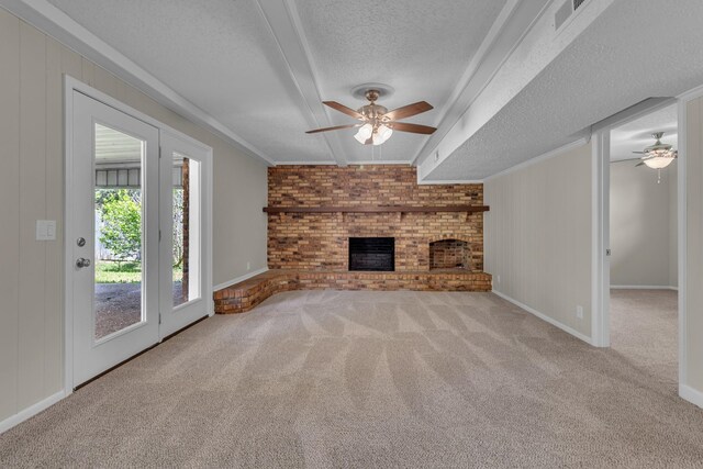520 Almaville Rd, Smyrna, TN 37167 - unfurnished living room featuring a ceiling fan, a textured ceiling, carpet, a fireplace, and baseboards