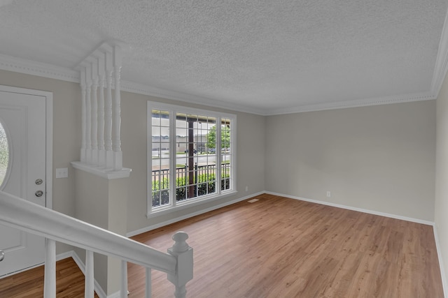 520 Almaville Rd, Smyrna, TN 37167 - unfurnished room featuring wood finished floors, a textured ceiling, crown molding, and baseboards