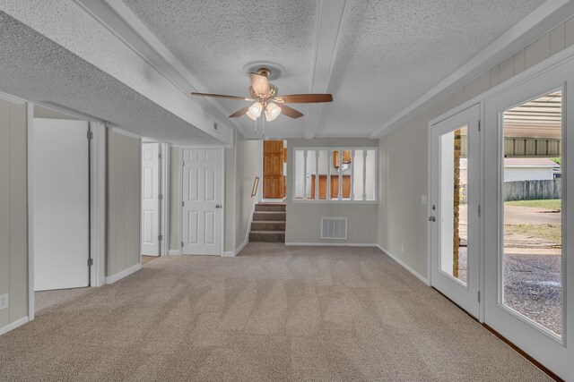 520 Almaville Rd, Smyrna, TN 37167 - unfurnished living room with ceiling fan, carpet flooring, a textured ceiling, beamed ceiling, and stairway