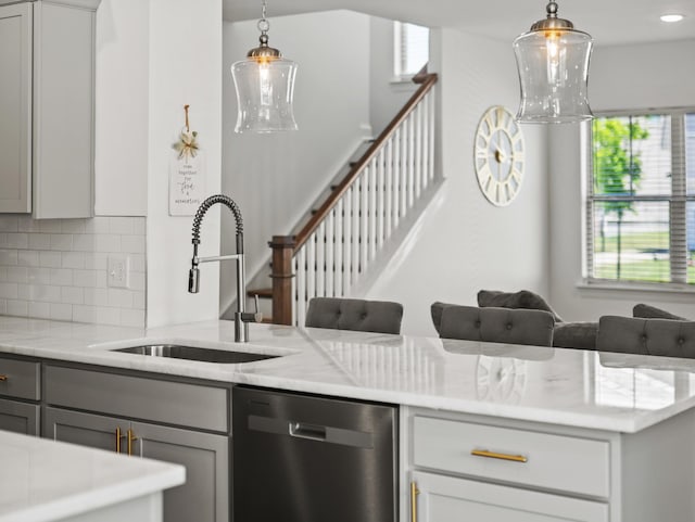 400 Parker Ct, Antioch, TN 37013 - kitchen with dishwasher, gray cabinets, a sink, tasteful backsplash, and light stone countertops