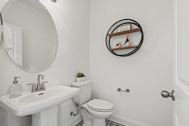 400 Parker Ct, Antioch, TN 37013 - bathroom featuring baseboards, toilet, and a sink
