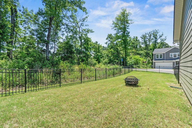400 Parker Ct, Antioch, TN 37013 - view of yard featuring a garage and an outdoor fire pit