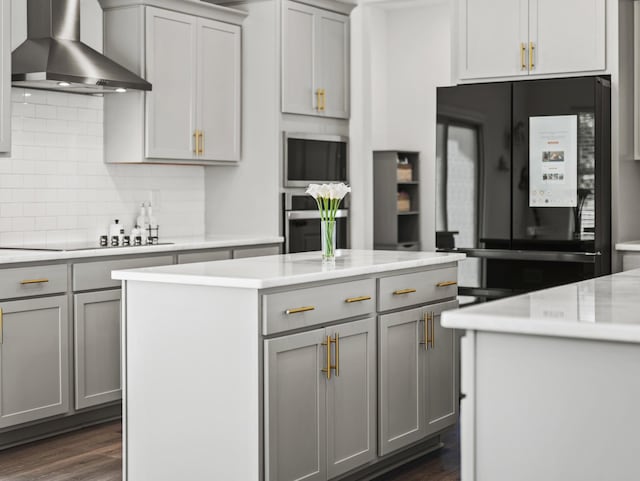 400 Parker Ct, Antioch, TN 37013 - kitchen featuring wall chimney exhaust hood, black appliances, gray cabinetry, a center island, and light countertops