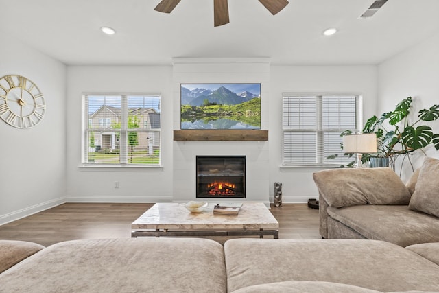 400 Parker Ct, Antioch, TN 37013 - living area featuring baseboards, a ceiling fan, wood finished floors, a large fireplace, and recessed lighting