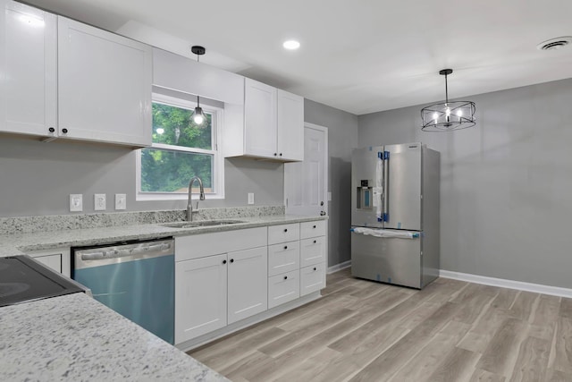 4904 Algonquin Trl, Antioch, TN 37013 - kitchen featuring stainless steel appliances, a sink, white cabinetry, light wood-style floors, and baseboards