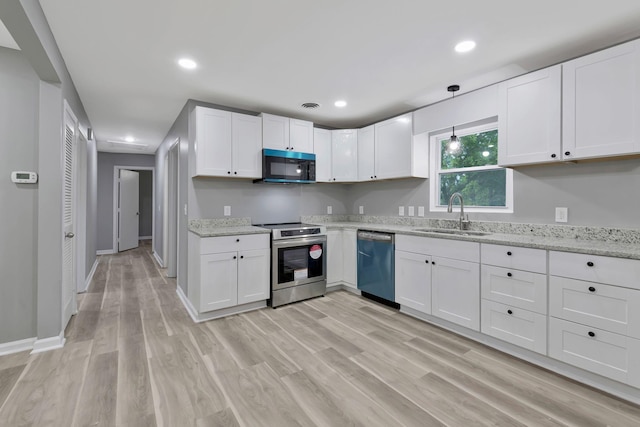 4904 Algonquin Trl, Antioch, TN 37013 - kitchen with electric range, a sink, dishwasher, black microwave, and white cabinetry