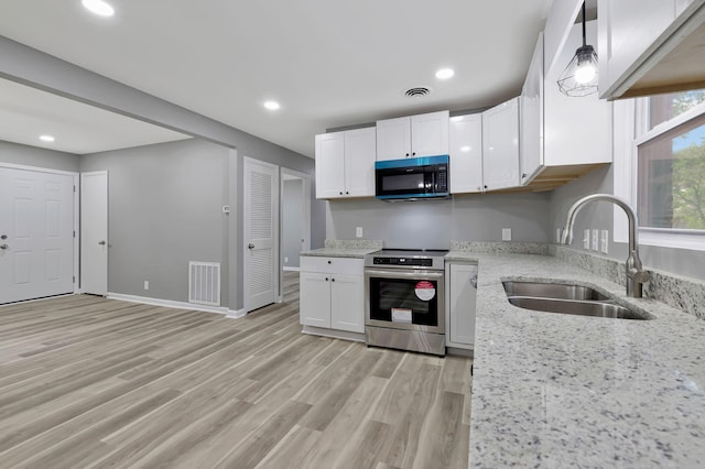 4904 Algonquin Trl, Antioch, TN 37013 - kitchen featuring black microwave, stainless steel range with electric stovetop, a sink, white cabinetry, and light stone countertops