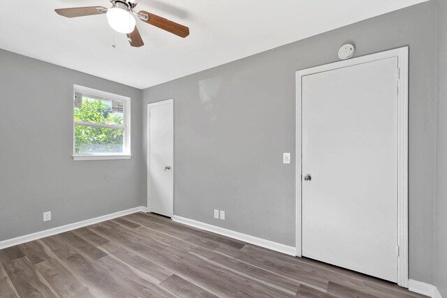 4904 Algonquin Trl, Antioch, TN 37013 - empty room featuring ceiling fan, wood finished floors, baseboards, and a smoke detector