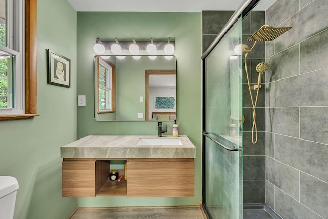 415 Isaac Dr, Goodlettsville, TN 37072 - full bathroom with a stall shower, vanity, and toilet