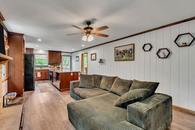 415 Isaac Dr, Goodlettsville, TN 37072 - living area with light wood-style flooring, a ceiling fan, and crown molding
