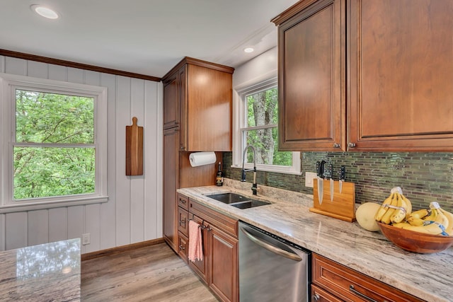 415 Isaac Dr, Goodlettsville, TN 37072 - kitchen with stainless steel dishwasher, a sink, light wood-style floors, decorative backsplash, and recessed lighting