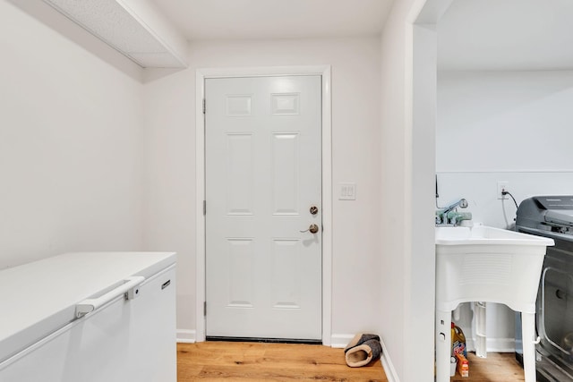 415 Isaac Dr, Goodlettsville, TN 37072 - laundry area with light wood-type flooring and washer / clothes dryer