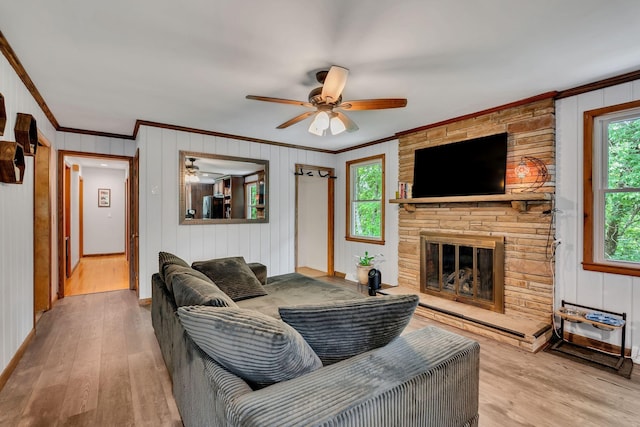 415 Isaac Dr, Goodlettsville, TN 37072 - living room featuring crown molding, ceiling fan, wood finished floors, plenty of natural light, and a fireplace
