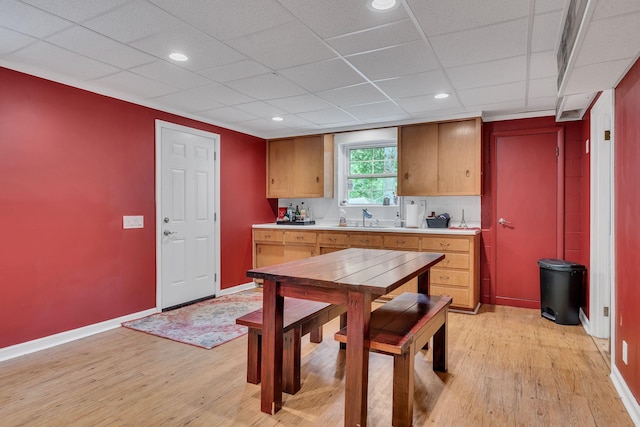 415 Isaac Dr, Goodlettsville, TN 37072 - kitchen with baseboards, light countertops, light wood finished floors, a paneled ceiling, and recessed lighting