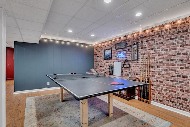 415 Isaac Dr, Goodlettsville, TN 37072 - playroom with a paneled ceiling, wood finished floors, brick wall, and baseboards