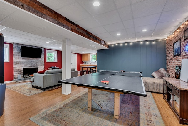 415 Isaac Dr, Goodlettsville, TN 37072 - recreation room featuring light wood-type flooring, plenty of natural light, a large fireplace, a paneled ceiling, and recessed lighting