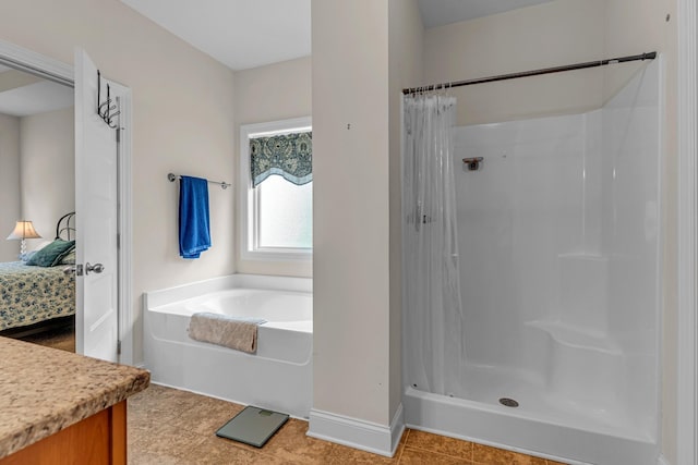817 Tanager Pl, Lebanon, TN 37087 - bathroom with a shower with shower curtain, a bath, connected bathroom, vanity, and baseboards