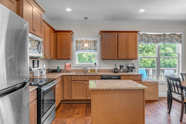 817 Tanager Pl, Lebanon, TN 37087 - kitchen featuring appliances with stainless steel finishes, a sink, dark wood finished floors, crown molding, and light stone counters