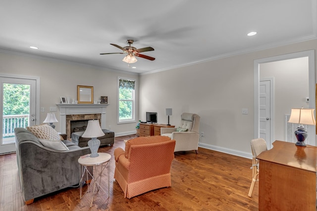 817 Tanager Pl, Lebanon, TN 37087 - living area featuring ceiling fan, wood finished floors, ornamental molding, a fireplace, and recessed lighting
