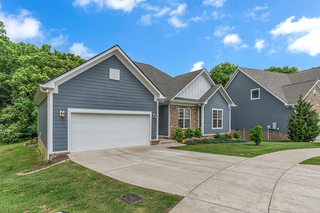 817 Tanager Pl, Lebanon, TN 37087 - view of front of house with board and batten siding, concrete driveway, a front yard, brick siding, and an attached garage