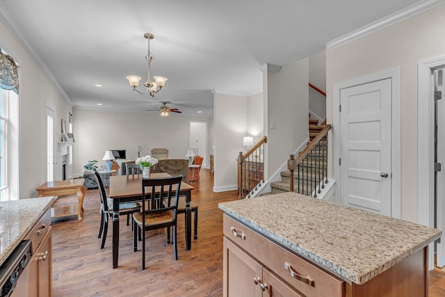 817 Tanager Pl, Lebanon, TN 37087 - dining space with ceiling fan, stairway, crown molding, a chandelier, and light wood-style flooring