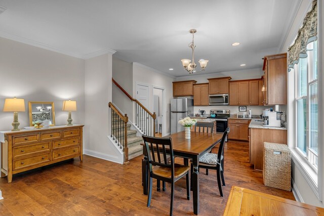817 Tanager Pl, Lebanon, TN 37087 - dining room featuring a chandelier, crown molding, recessed lighting, stairway, and baseboards