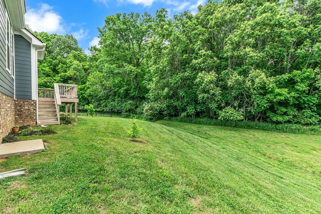 817 Tanager Pl, Lebanon, TN 37087 - view of green lawn with stairs and a wooden deck