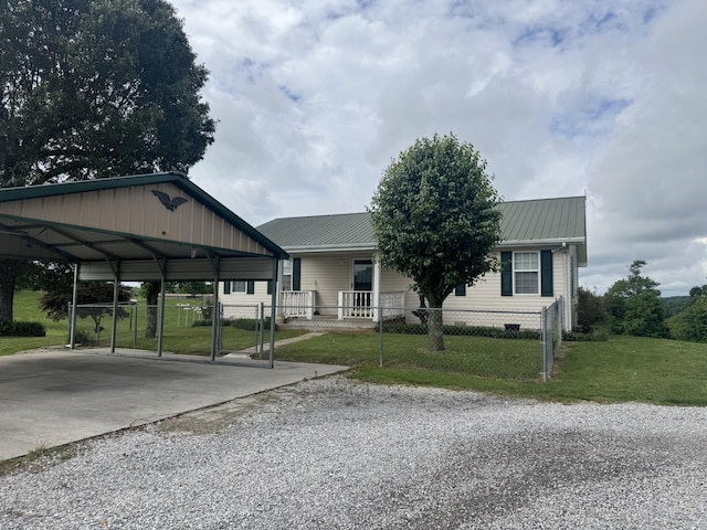 325 Lafayette Ct, Moss, TN 38575 - view of front facade with driveway, metal roof, and a carport