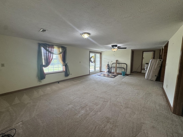 325 Lafayette Ct, Moss, TN 38575 - unfurnished living room with light colored carpet, a ceiling fan, a textured ceiling, and baseboards