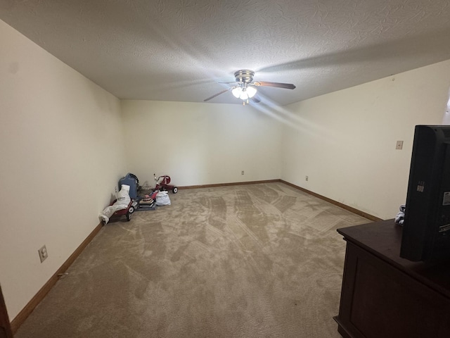 325 Lafayette Ct, Moss, TN 38575 - additional living space with ceiling fan, light colored carpet, baseboards, and a textured ceiling