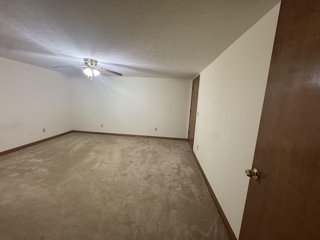 325 Lafayette Ct, Moss, TN 38575 - spare room with light colored carpet, a ceiling fan, baseboards, and a textured ceiling