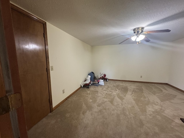 325 Lafayette Ct, Moss, TN 38575 - empty room with light carpet, a ceiling fan, a textured ceiling, and baseboards