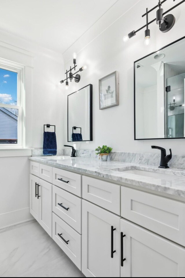 117 Park Cir, Columbia, TN 38401 - full bathroom featuring double vanity, marble look tiles, a shower with door, and baseboards