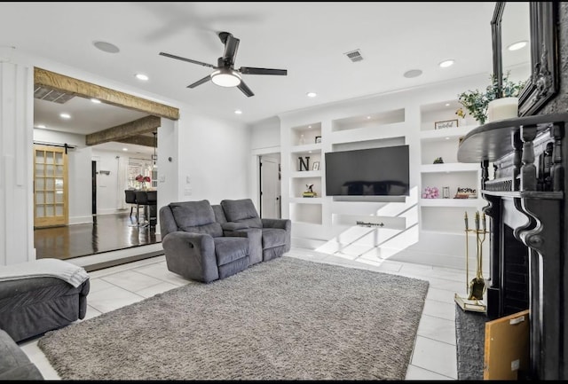 117 Park Cir, Columbia, TN 38401 - living room featuring a ceiling fan, built in shelves, a barn door, recessed lighting, and tile patterned floors