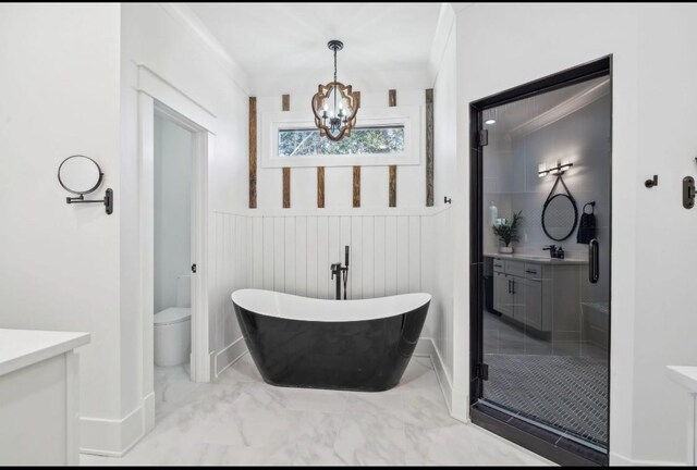 117 Park Cir, Columbia, TN 38401 - full bathroom featuring marble finish flooring, a chandelier, vanity, a freestanding bath, and toilet
