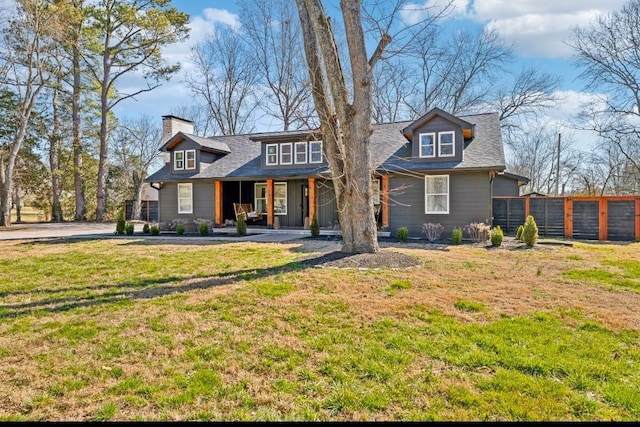 117 Park Cir, Columbia, TN 38401 - view of front facade with covered porch, a front lawn, and a chimney