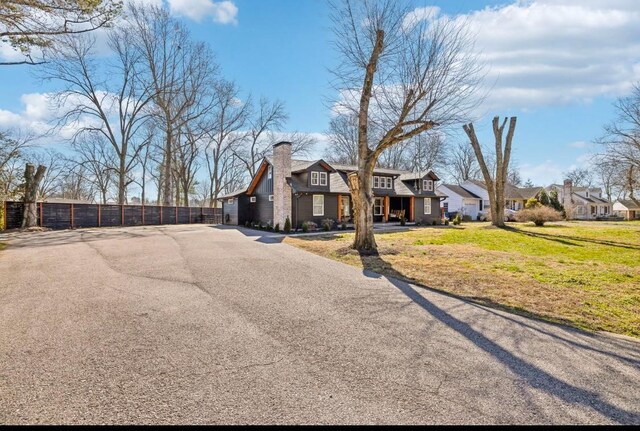 117 Park Cir, Columbia, TN 38401 - view of front facade with a residential view, a chimney, and driveway