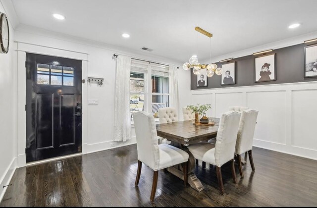 117 Park Cir, Columbia, TN 38401 - dining room featuring a decorative wall, dark wood-style floors, ornamental molding, a chandelier, and recessed lighting