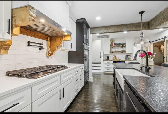 117 Park Cir, Columbia, TN 38401 - kitchen with appliances with stainless steel finishes, wall chimney range hood, a sink, open shelves, and tasteful backsplash