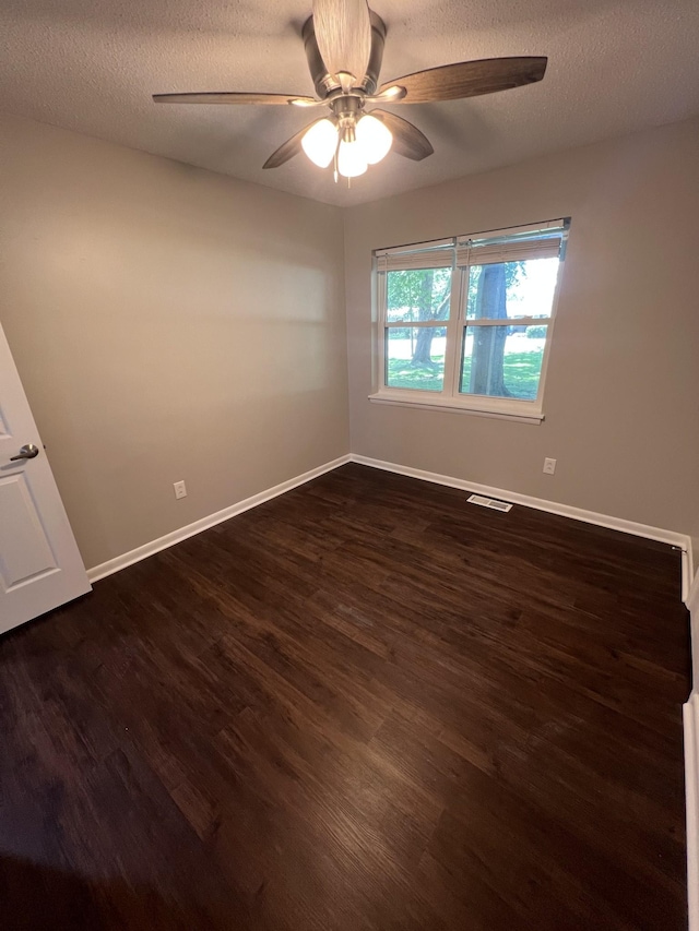1846 Patrick Rd, Pulaski, TN 38478 - empty room featuring dark wood-type flooring, a ceiling fan, baseboards, and a textured ceiling
