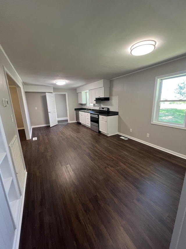 1846 Patrick Rd, Pulaski, TN 38478 - unfurnished living room with dark wood-style flooring and baseboards
