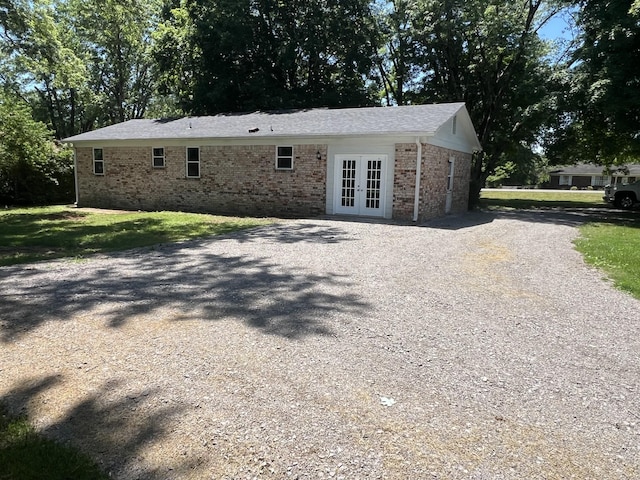 1846 Patrick Rd, Pulaski, TN 38478 - rear view of property featuring french doors, gravel driveway, and brick siding