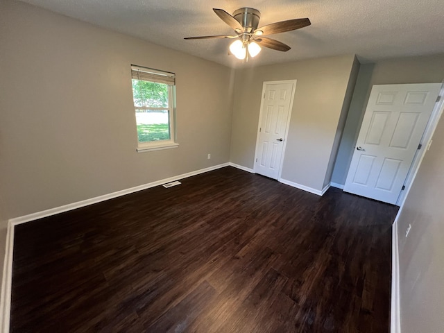 1846 Patrick Rd, Pulaski, TN 38478 - spare room with dark wood-style floors, a ceiling fan, baseboards, and a textured ceiling