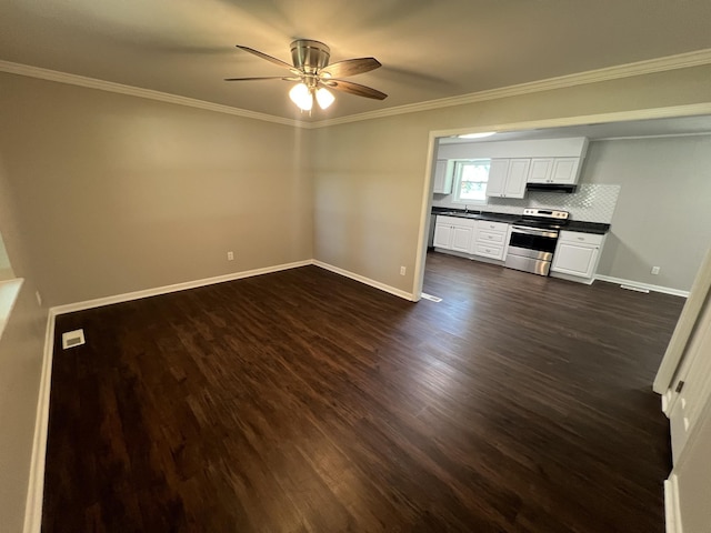 1846 Patrick Rd, Pulaski, TN 38478 - unfurnished living room featuring a ceiling fan, baseboards, dark wood-style flooring, and ornamental molding