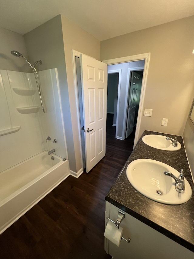 1846 Patrick Rd, Pulaski, TN 38478 - bathroom featuring wood finished floors, shower / bath combination, double vanity, and baseboards