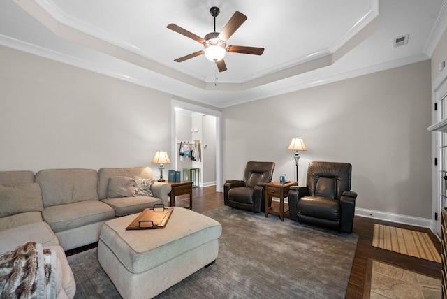 258 Bellshire Dr, Clarksville, TN 37043 - living area featuring crown molding, a ceiling fan, a raised ceiling, wood finished floors, and baseboards