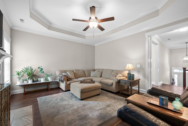 258 Bellshire Dr, Clarksville, TN 37043 - living room with wood finished floors, ceiling fan, a raised ceiling, baseboards, and crown molding