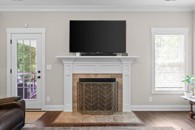 258 Bellshire Dr, Clarksville, TN 37043 - living room featuring light wood-type flooring, a fireplace, baseboards, and crown molding