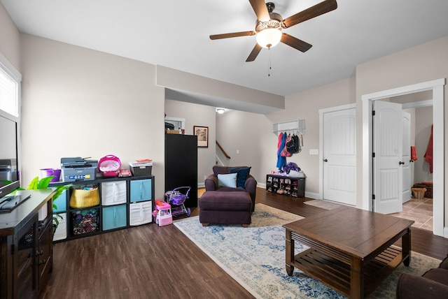258 Bellshire Dr, Clarksville, TN 37043 - living area with ceiling fan, stairway, wood finished floors, and baseboards